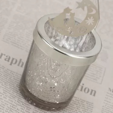 Dekoratyvinė žvakidė su besisukančiomis dekoracijomis "Mėnuliai", 16 x 6 cm